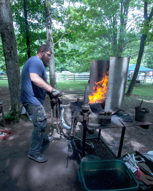 Image of blacksmith with forge
